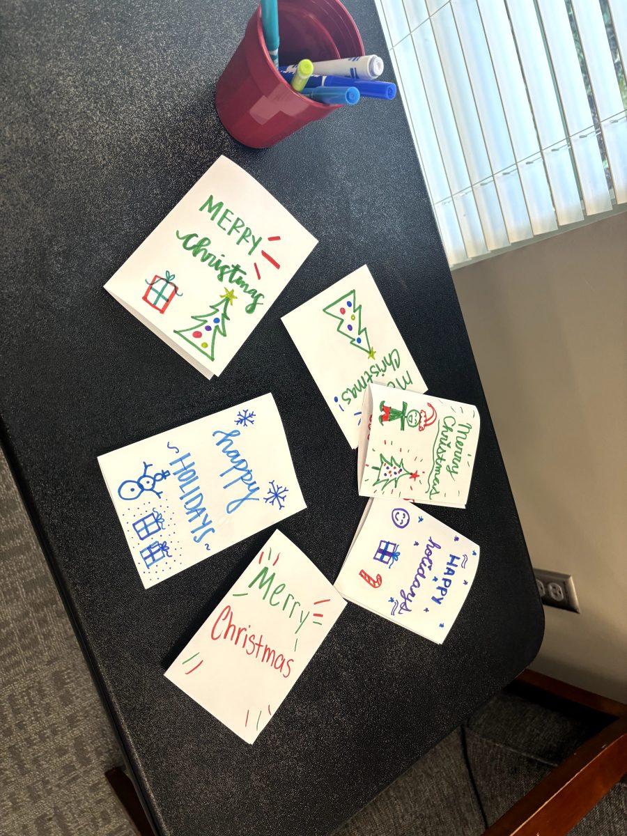 Students drew holiday-themed cards to accompany the toy donations.