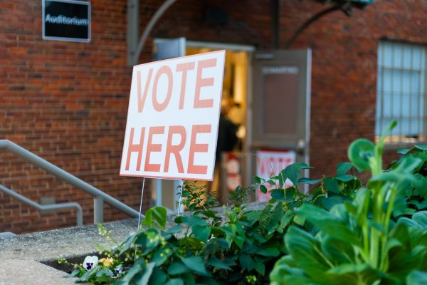 A "Vote Here" sign outside of a polling center.