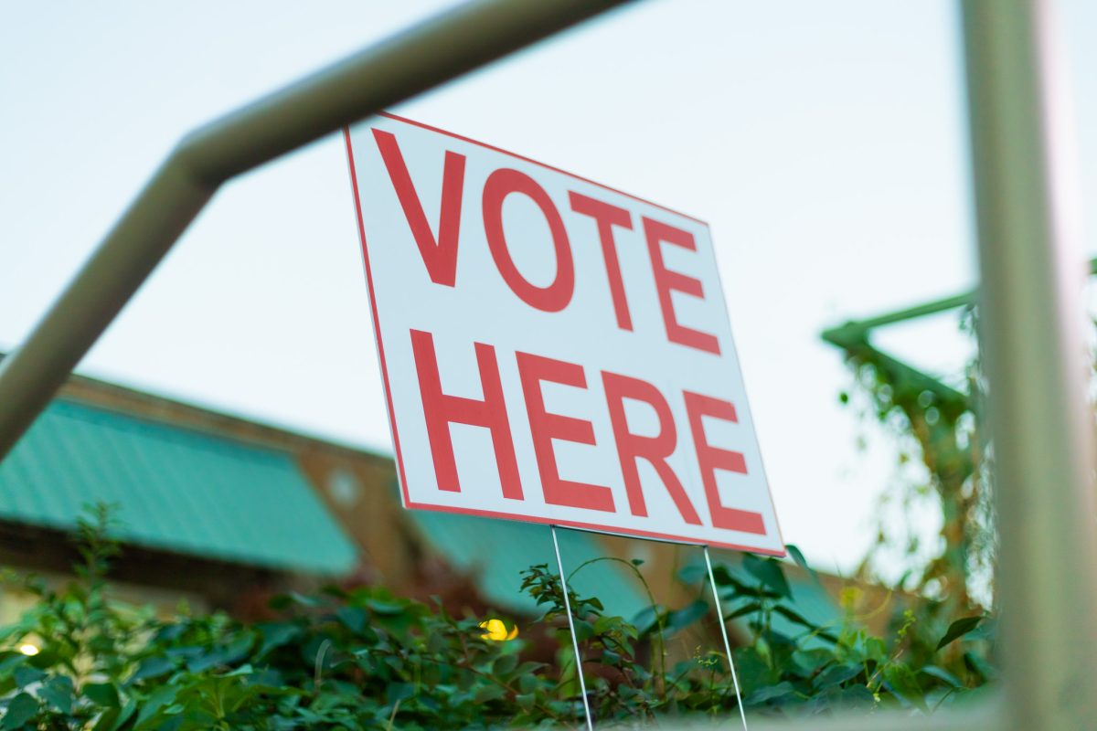 A "Vote Here" sign outside of a polling center.