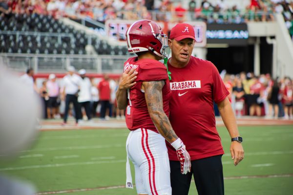 Alabama head coach Kalen DeBoer talks with a player during the South Florida game on Sept. 7, 2024.