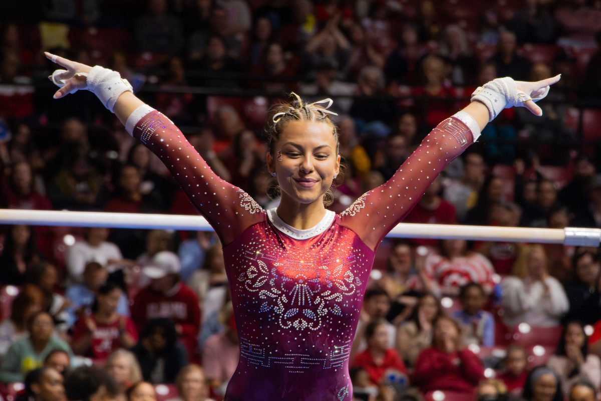 Alabama gymnast Cameron Macado performs against Illinois, Minnesota and Talladega.