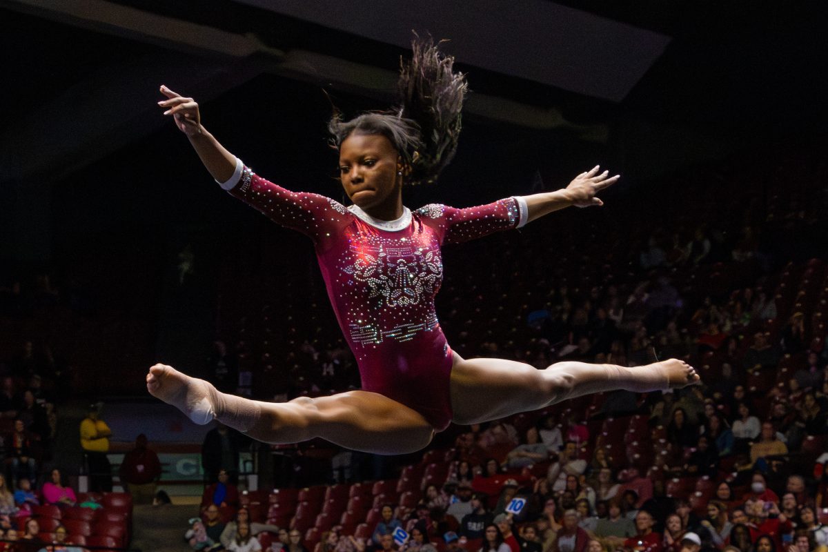 Jamison Sears performs a beam routine. 