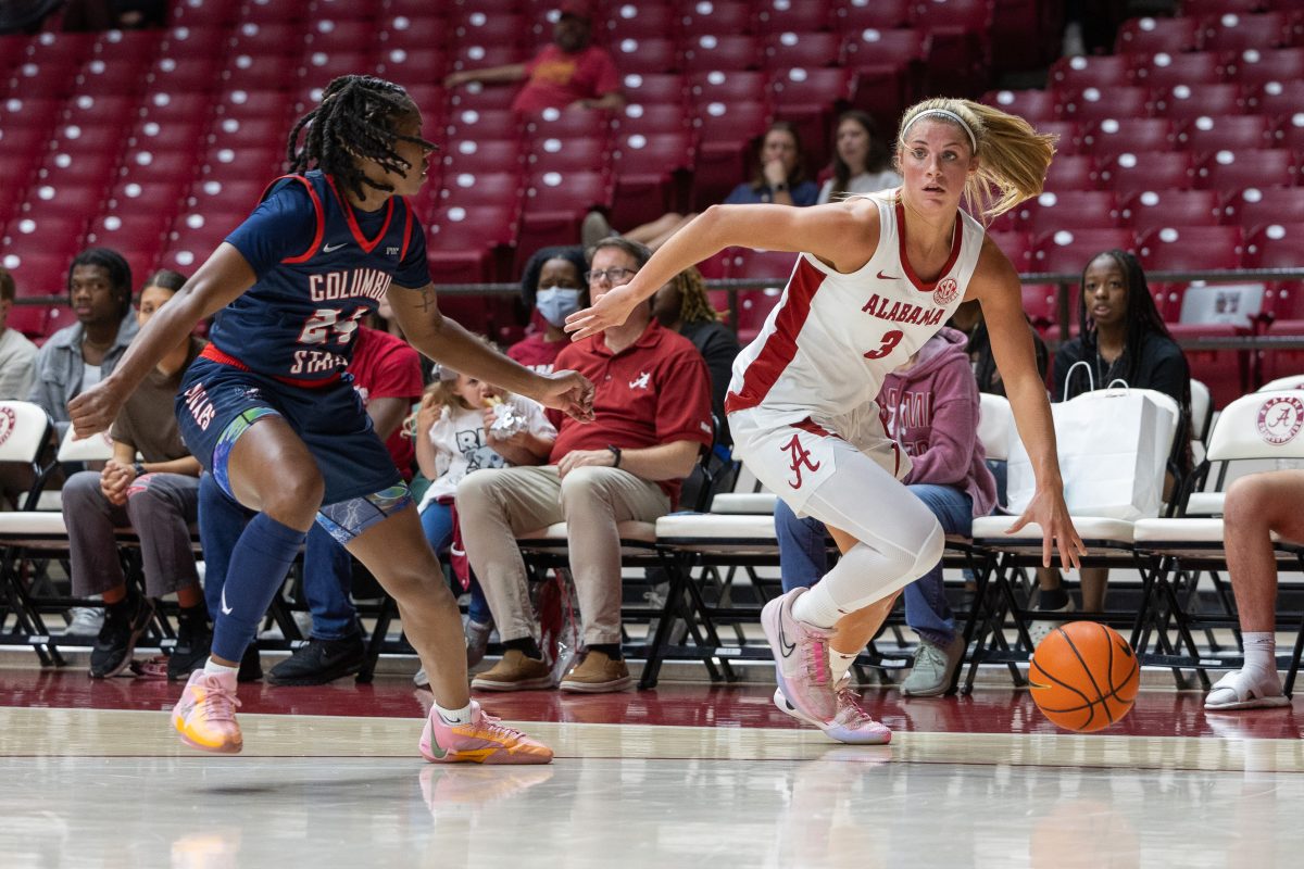 Alabama guard Sarah Ashlee Barker (#3) dribbles past a Columbus State defender.