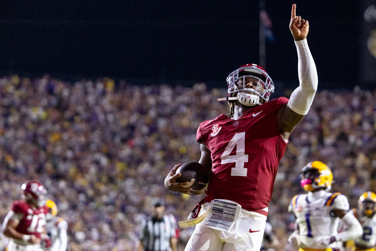 Alabama quarterback Jalen Milroe (#4) celebrates after a touchdown. 