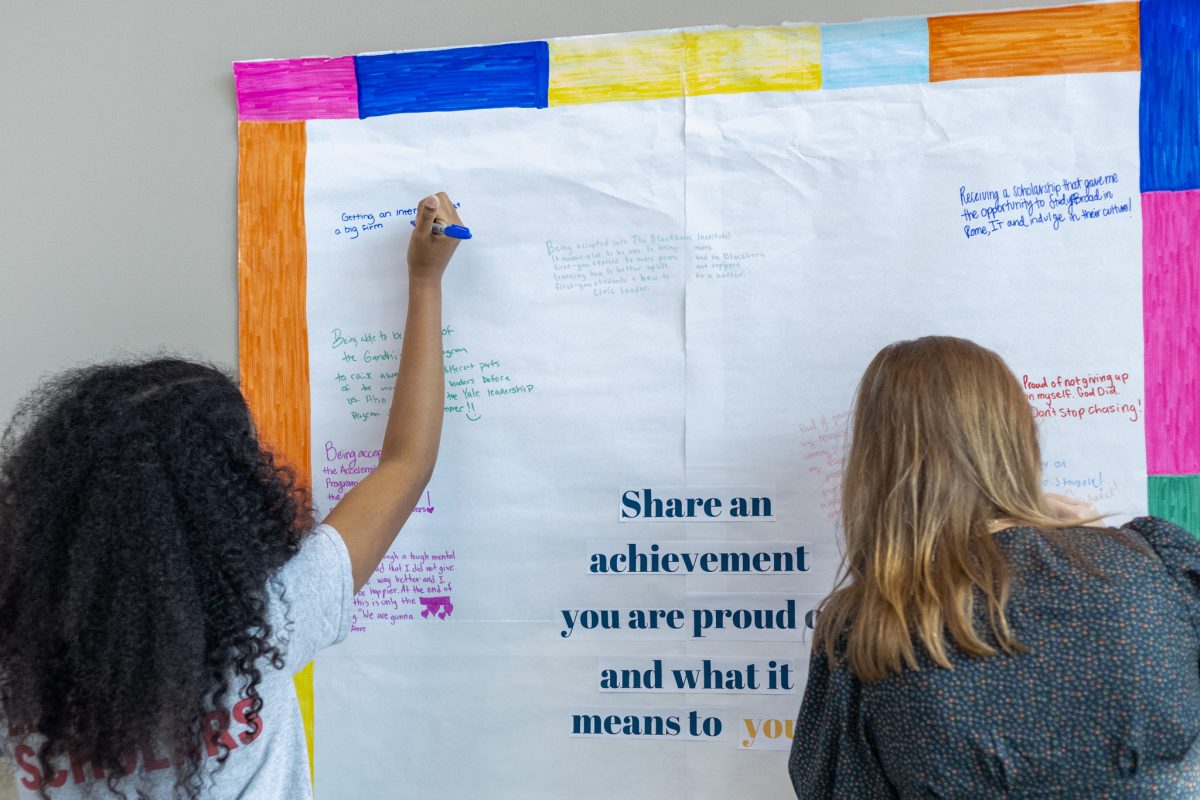 Students write down what achievements they are proud of. 