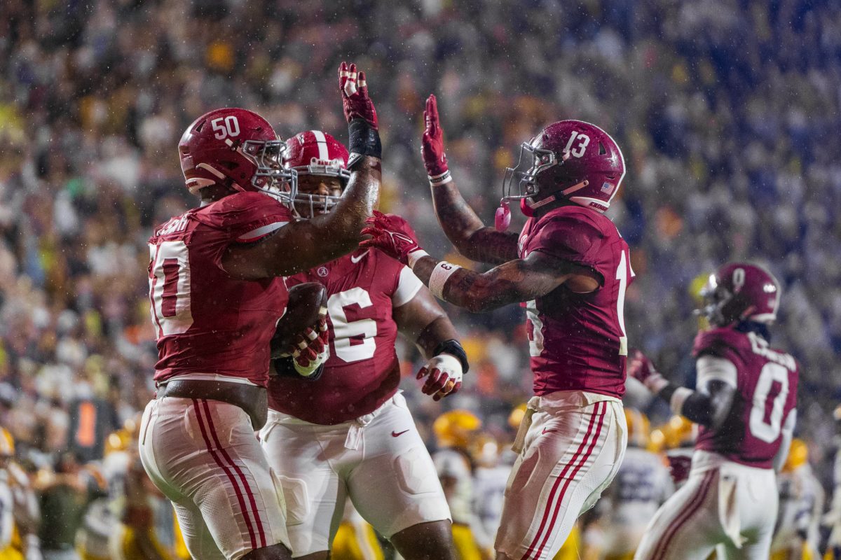 Alabama defender celebrate after a play against LSU.