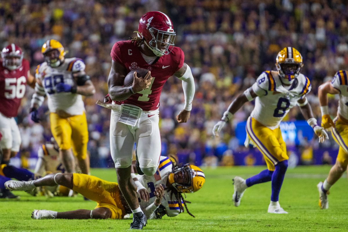 Alabama quarterback Jalen Milroe runs towards the endzone. 