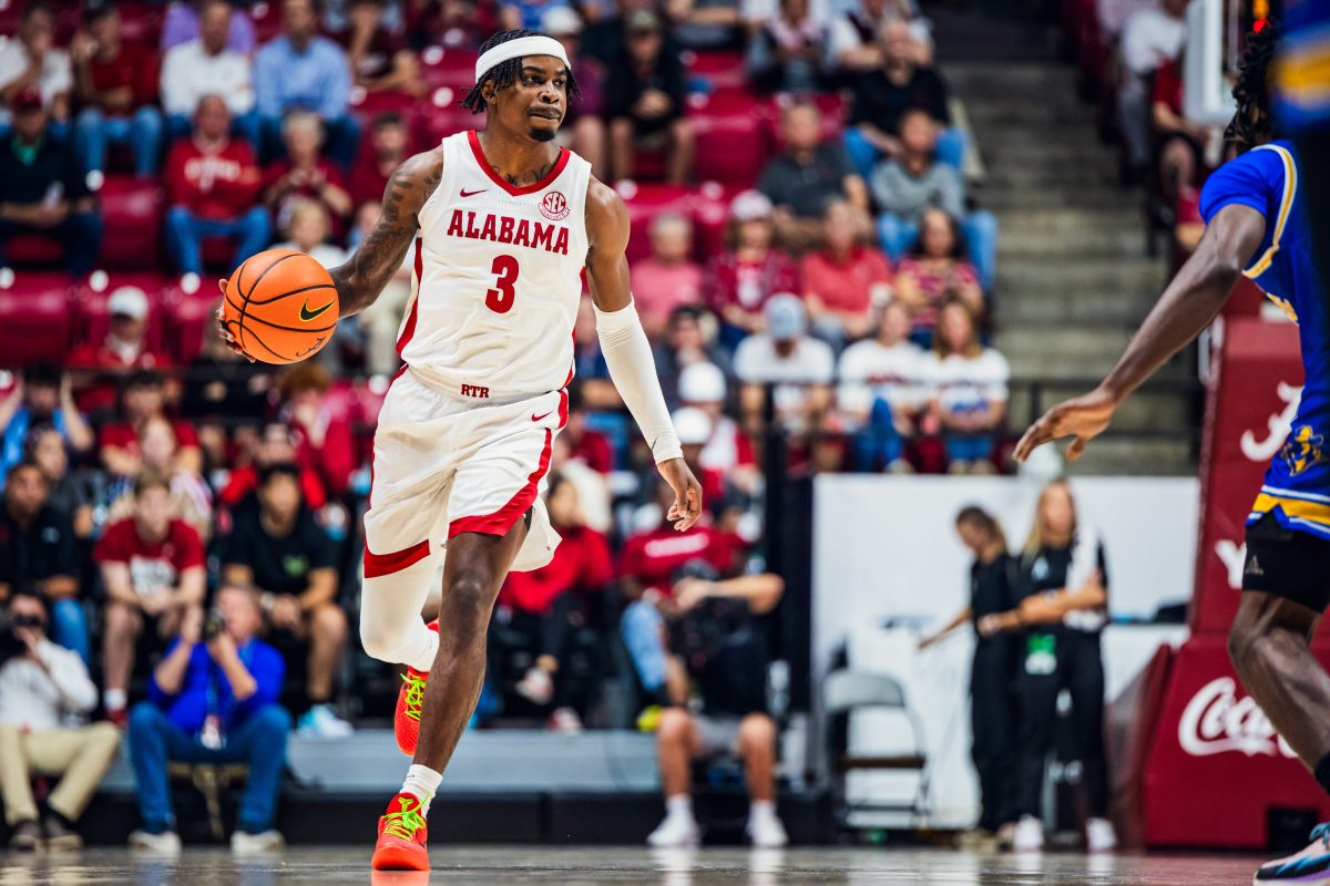 Alabama guard Latrell Wrightsell Jr. (#3) dribbles down the court against McNeese State.