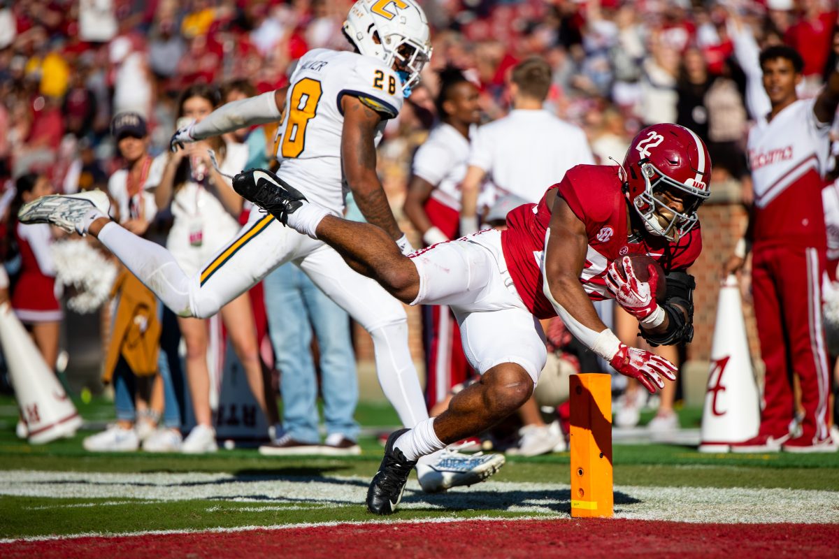 Alabama running back Justice Haynes scores a touchdown against UT Chattanooga during the 2023 season.