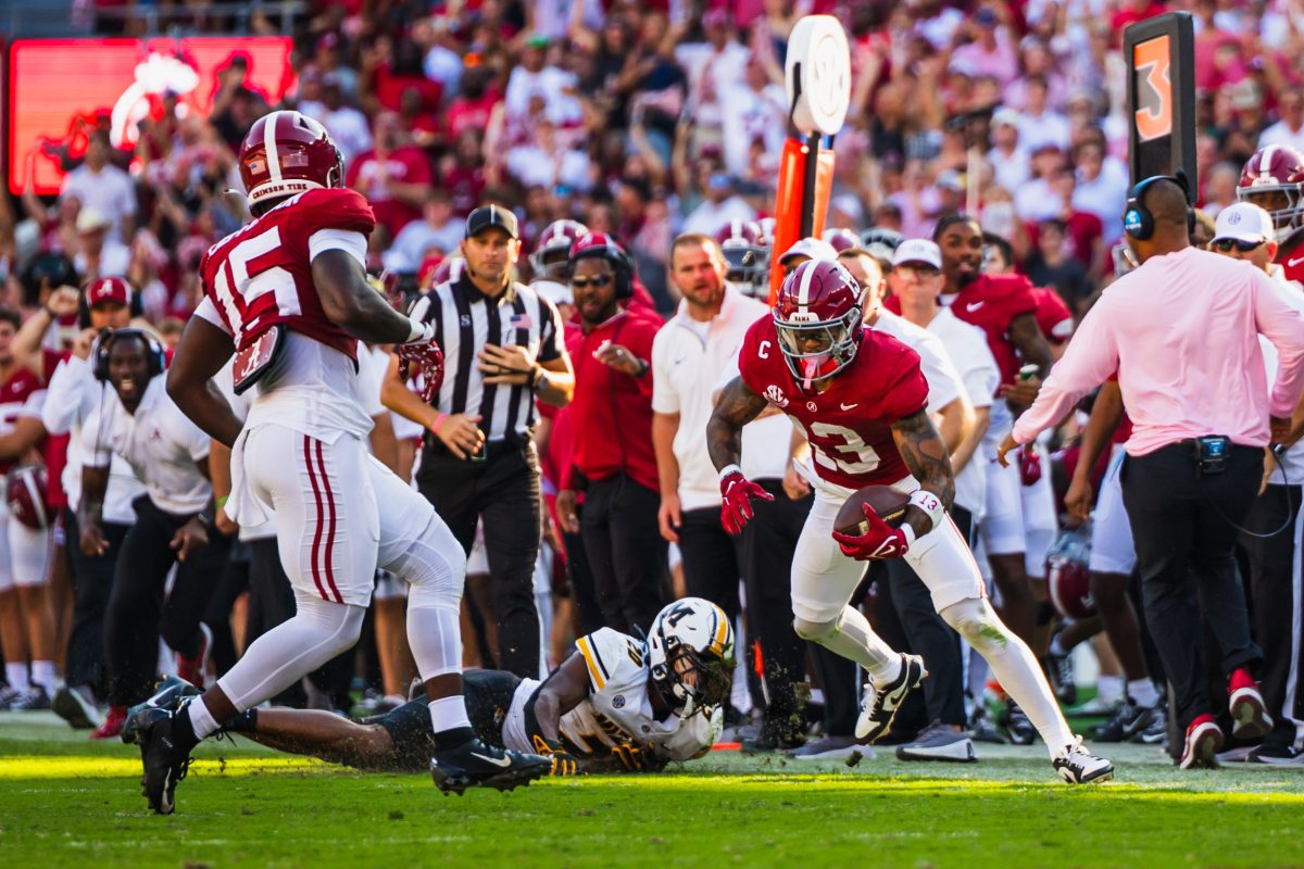 Alabama defensive back Malachi Moore (#13) escapes a Missouri player following an interception.