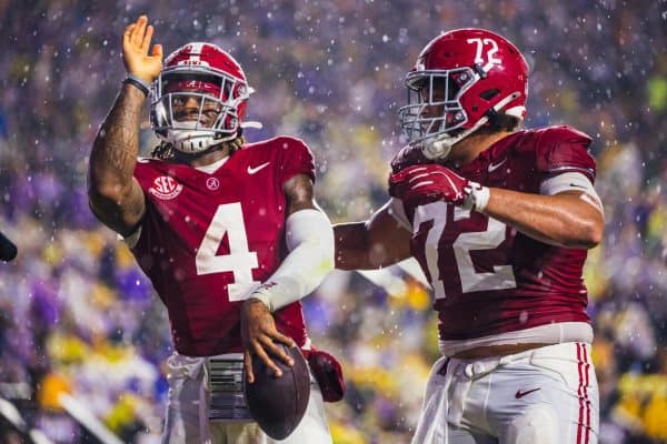 Alabama quarterback Jalen Milroe (#4) celebrates after scoring a touchdown against LSU.