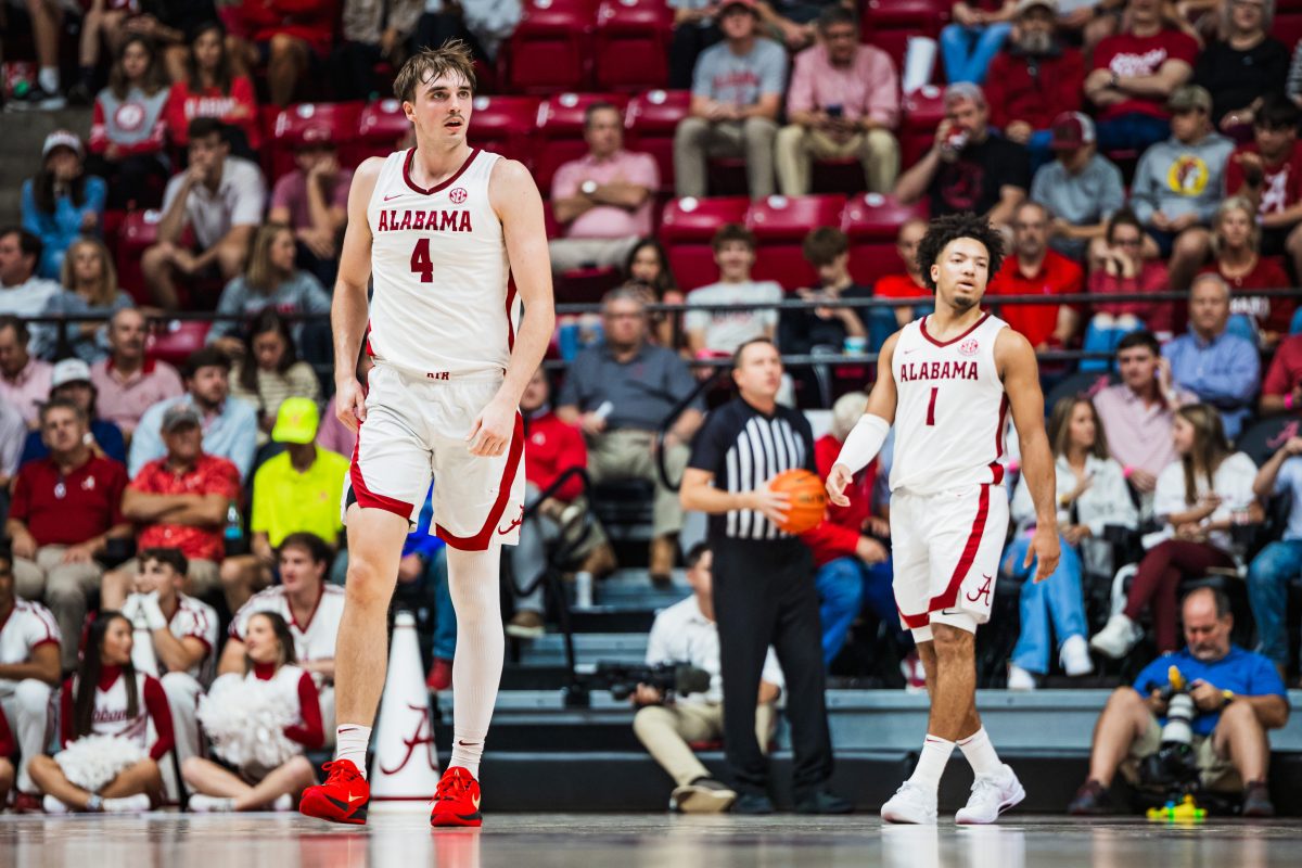 Forward Grant Nelson (#4) and guard Mark Sears (#1) play in Alabama's game against McNeese on Nov. 11. 