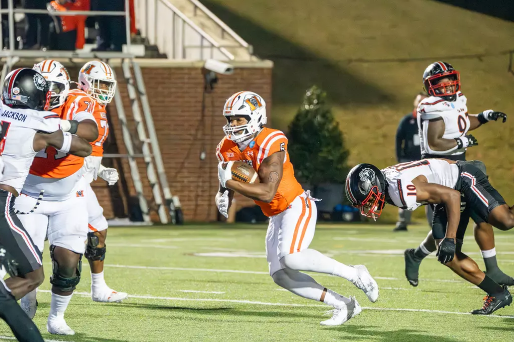 Mercer running back Al Wooten II (#5) runs the ball in 2023.