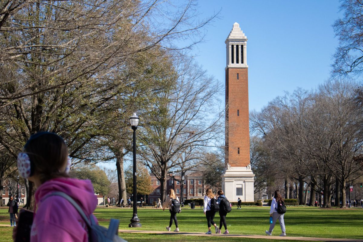 Students walking in front of Denny Chimes. 