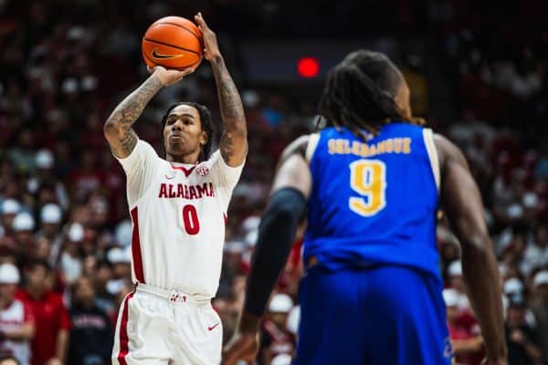 Alabama guard Labaron Philon (#0) takes a shot against McNeese State.