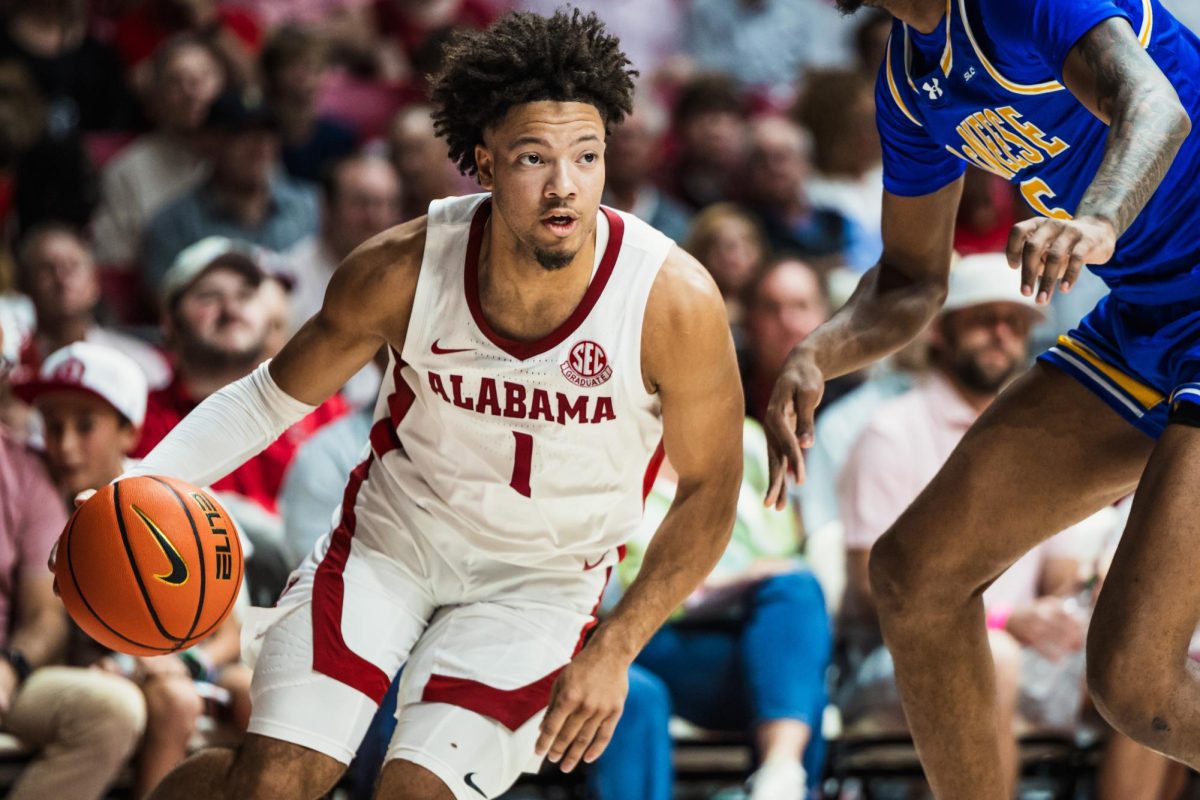 Alabama Guard Mark Sears dribbles against a defender in Alabama's game against McNeese on Nov. 11. 