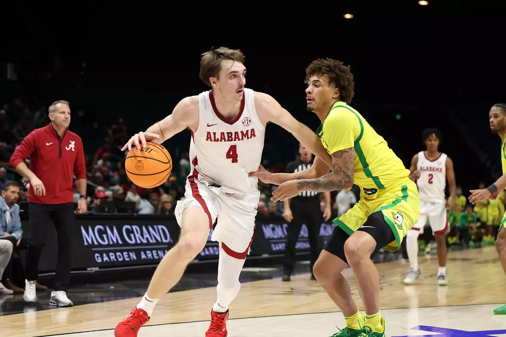 Alabama forward Grant Nelson (#4) drives against Oregon at MGM Grand Garden Arena in Las Vegas, NV on Saturday, Nov 30, 2024.
