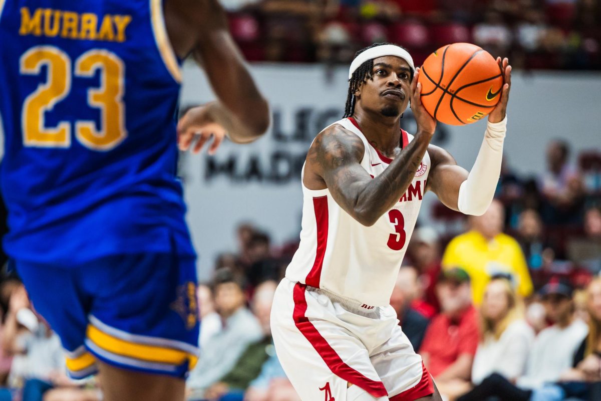 Guard Latrell Wrightsell Jr. goes to shoot the ball in Alabama's game against McNeese State on Nov. 11. 