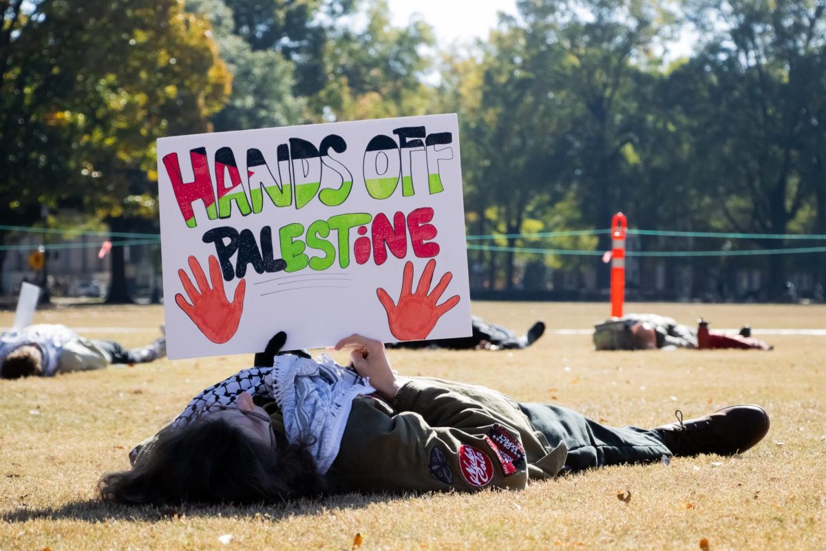 Students lie on the Quad as part of a 'die-in' protest.