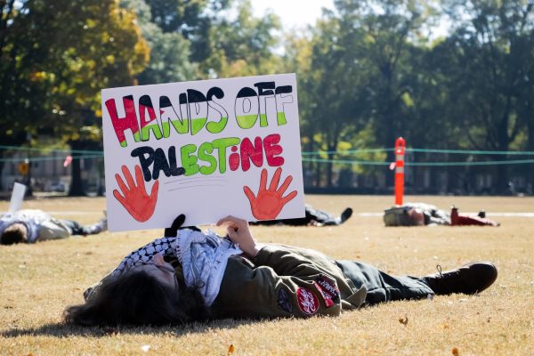 Students lie on the Quad as part of a 'die-in' protest.