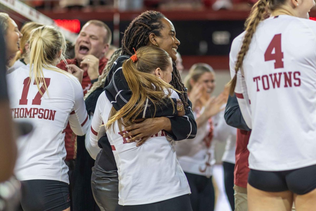 Head coach Rashinda Reed hugs defensive specialist Lindsey Brown after Alabama's win over Auburn. 