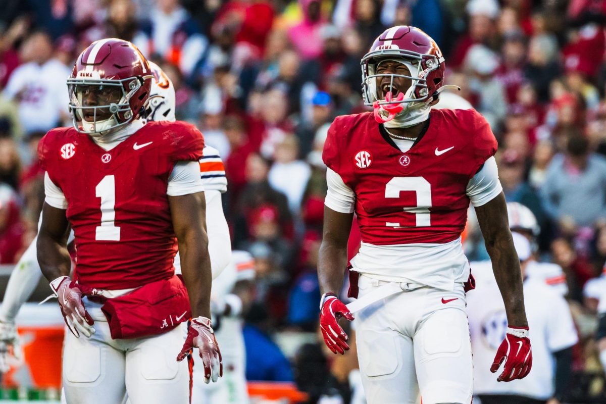 Kendrick Law (#1) and Emmanuel Henderson Jr. (#3) celebrate in Alabama's game against Auburn on Nov. 30. 