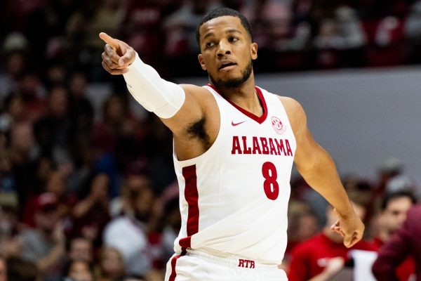 Alabama guard Chris Youngblood points in the team's game against Kent State. 