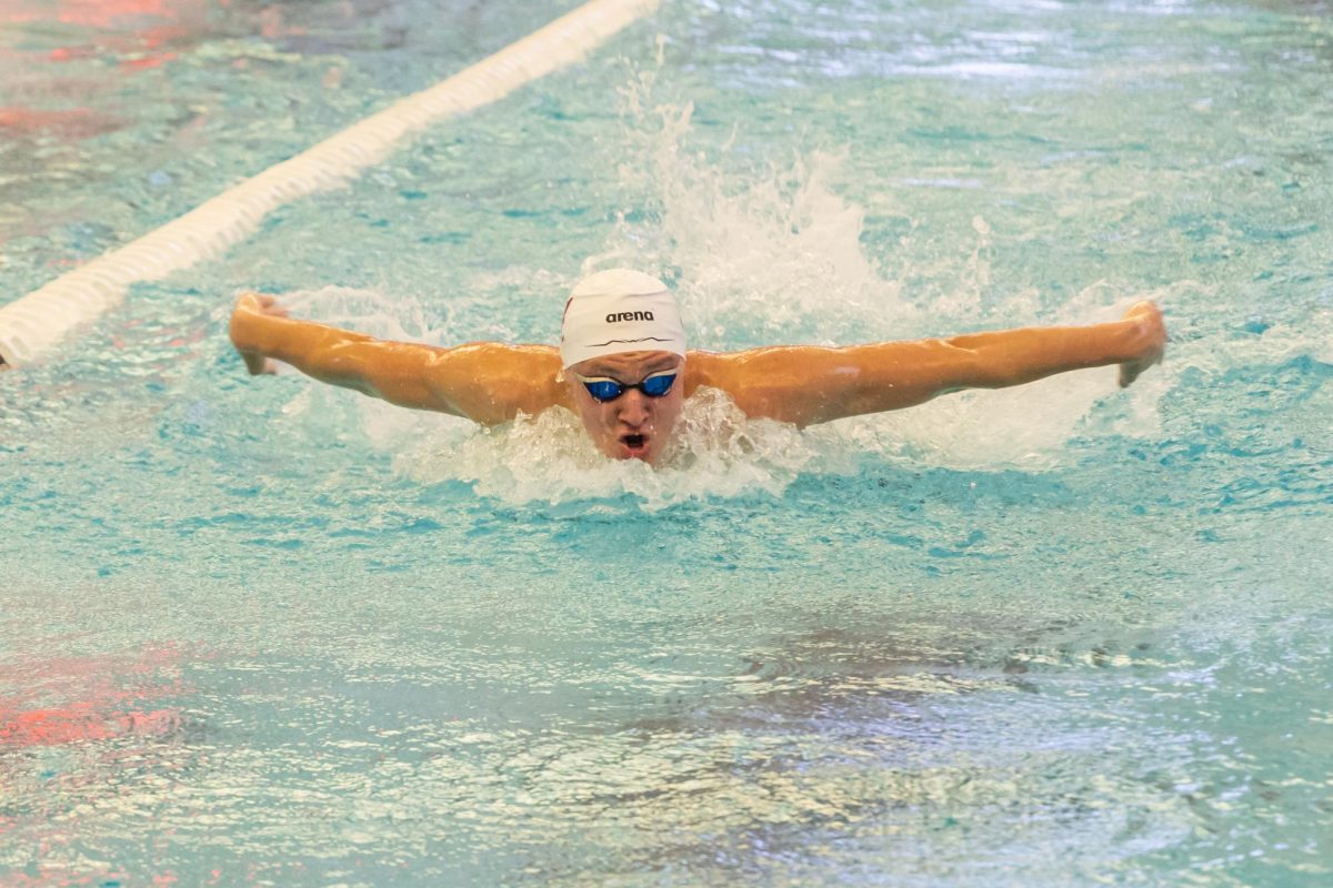 An Alabama swimmer competes against Tennessee.