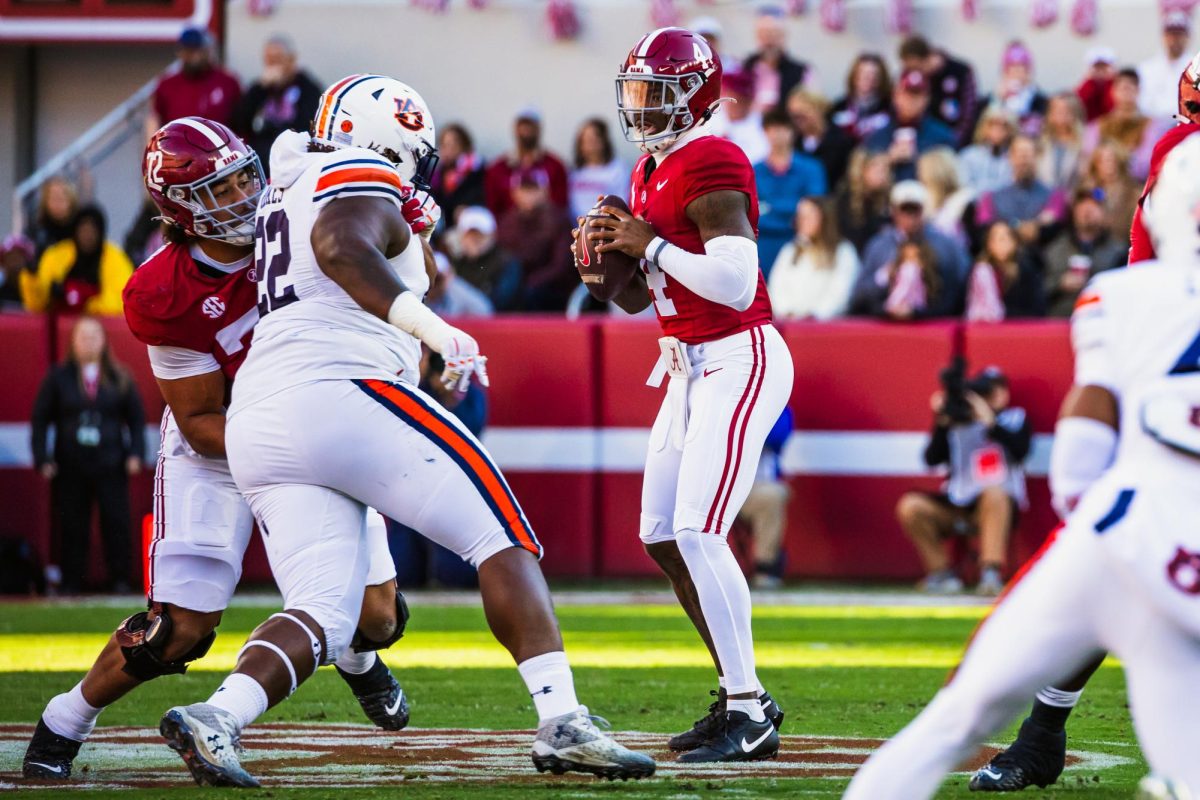 Alabama quarterback Jalen Milroe (#4) looks to pass against Auburn.