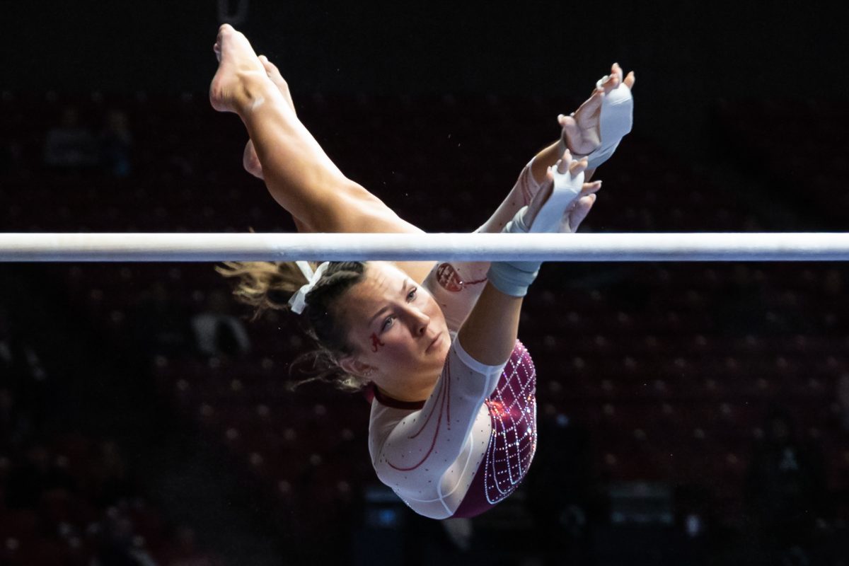 Alabama Gymnast preforms a bar routine. 