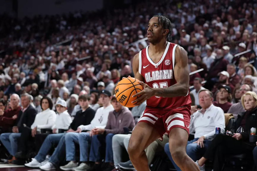 Alabama forward Derrion Reid (#35) looks to make a three against Texas A&M.