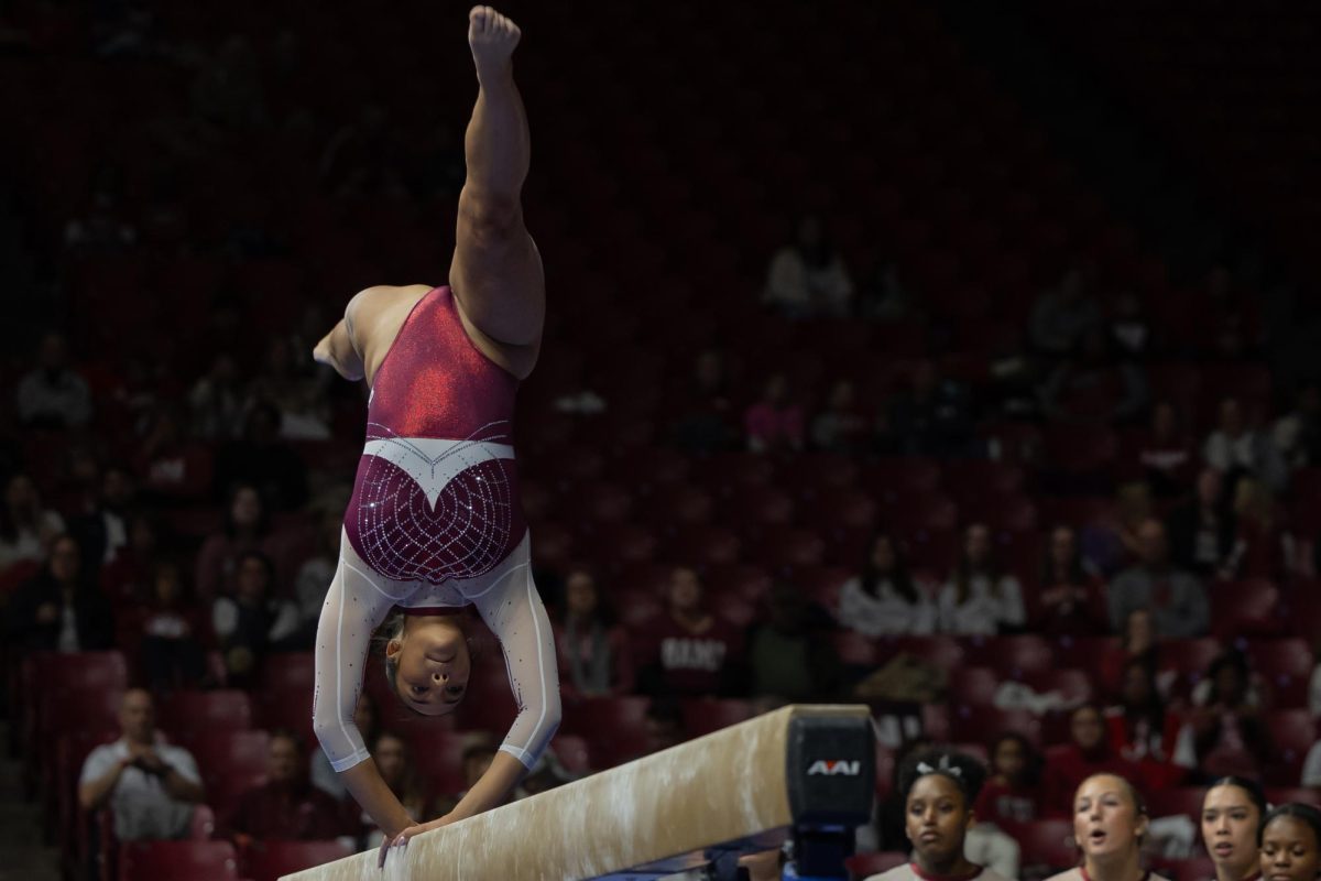 Alabama Gymnast competes on beam against North Carolina. 