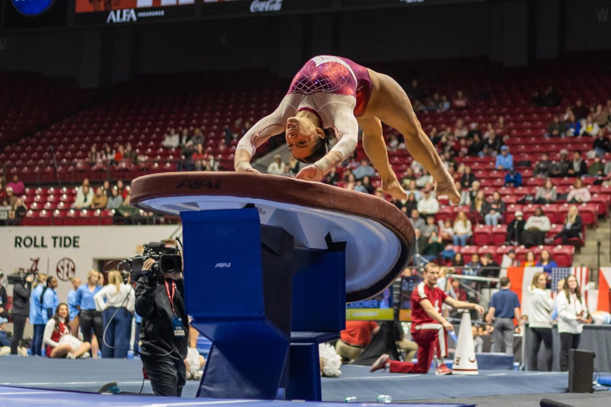 Alabama Gymnast performs a Vault routine against North Carolina. 