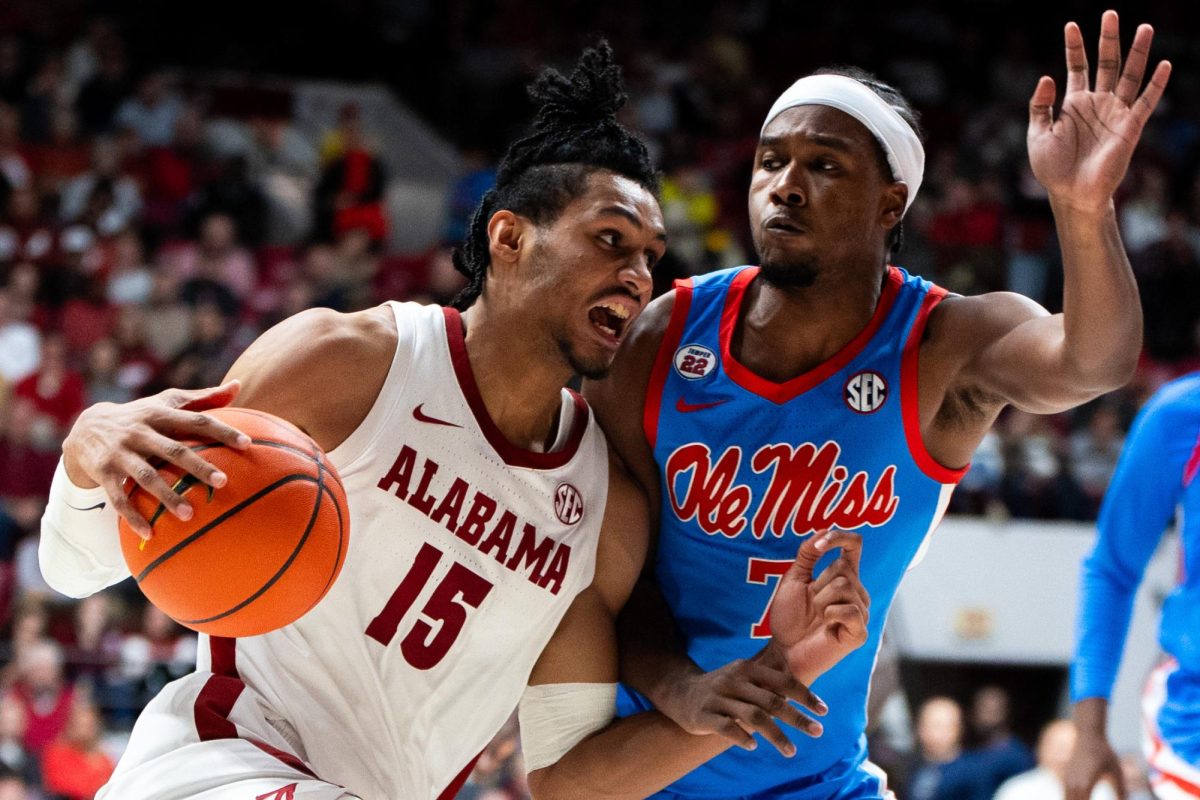 Alabama forward Jarin Stevenson (#15) pushes toward the net against Ole Miss