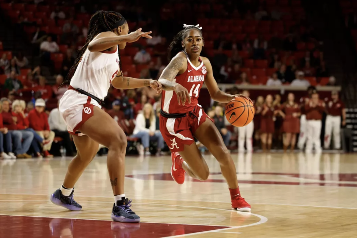 Alabama guard Zaay Green (#14) drives to the basket at Lloyd Noble Center in Norman, OK on March 2, 2025.