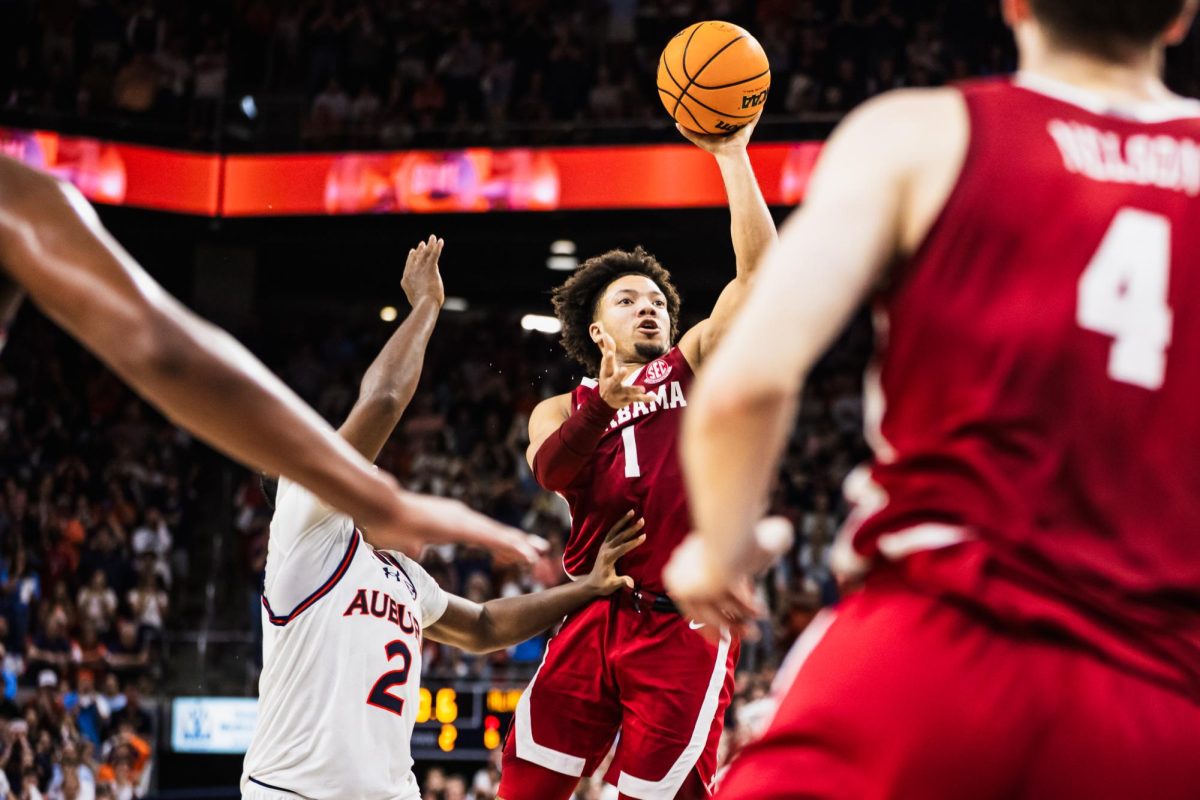 Alabama guard Mark Sears (#1) shoots the game-winning goal against Auburn at Neville Arena in Auburn, AL on March 8, 2025.