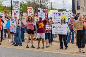 Tuscaloosans rally at a Hands Off! protest against President Donald Trump.
