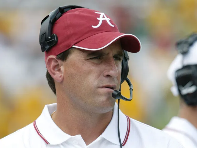 Former head coach Mike Shula coaching for Alabama.