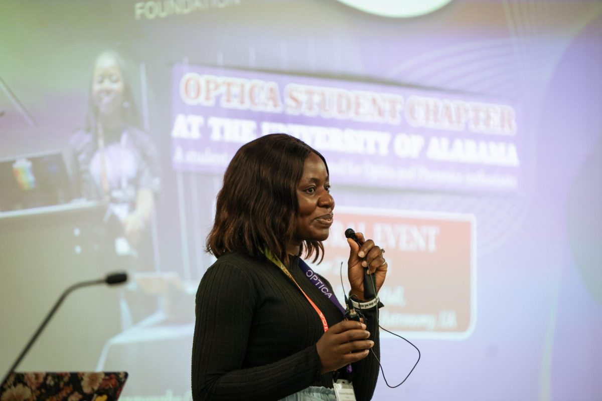 Catherine Obaze speaks to students at the UA OPTICA launch event.