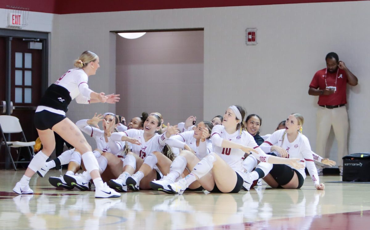 Alabama volleyball players celebrate after a play against UCF on Sept. 20, 2025. 