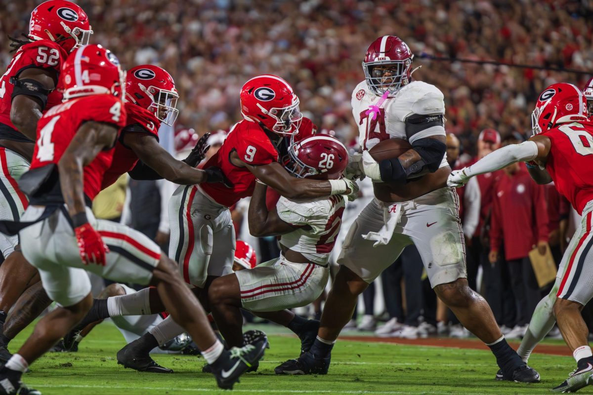 Alabama offensive lineman Kadyn Proctor (#74)  runs toward the endzone against Georgia on Sept. 27, 2025, in Athens, GA.