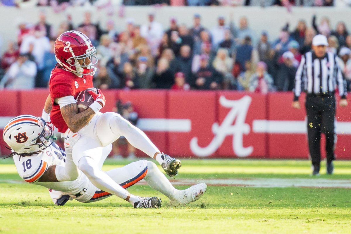 Alabama wide receiver Ryan Williams (#2) is tackled during the game versus Auburn on Nov. 30, 2024.
