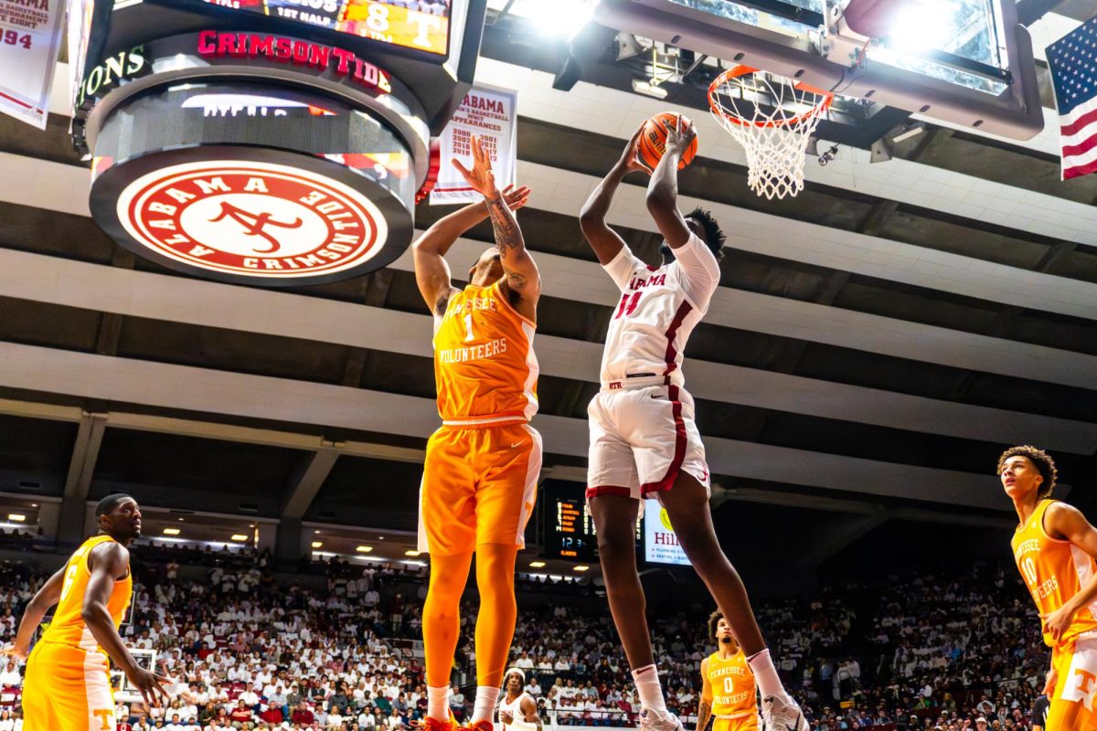 Alabama center Charles Bediako (#14) grabs a rebound in the game versus Tennessee on Jan. 24, 2026 at Coleman Coliseum in Tuscaloosa, AL. 