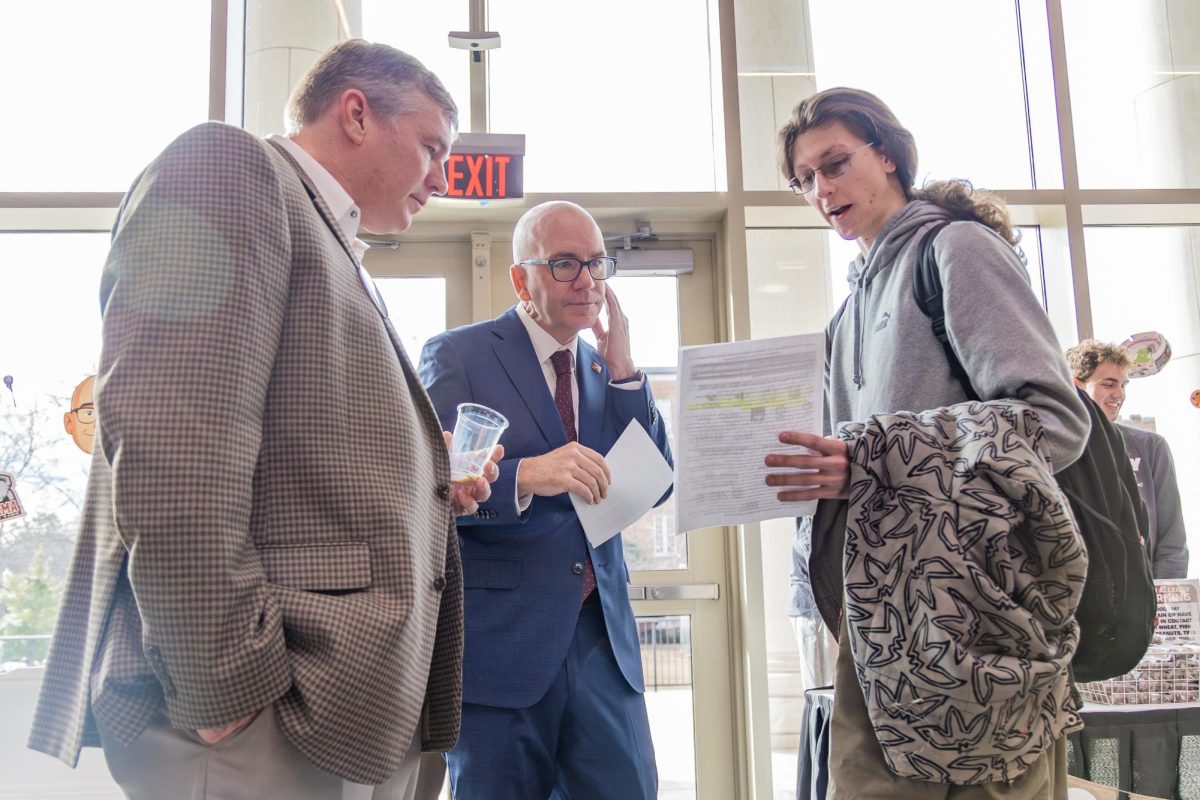 Members of Students for Justice in Palestine at the University of Alabama hand a list of demands to President Peter Mohler.