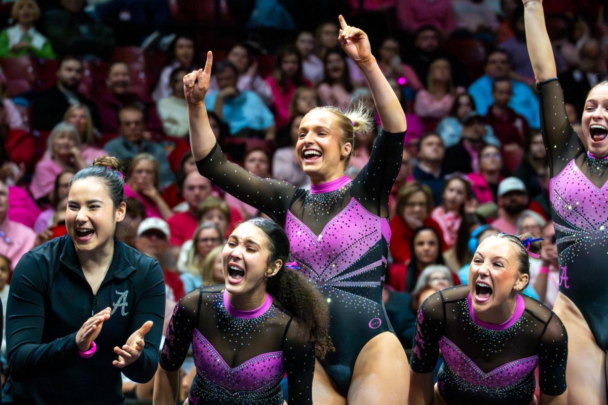 The Alabama gymnastics team celebrating during the meet against Arkansas on Feb. 13, 2026, in Coleman Coliseum. 