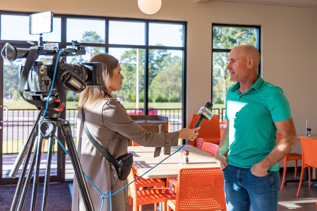 John Cassimus, owner of Zoës and Marky’s Kitchen in Tuscaloosa, speaks to the media at the restaurant opening on Oct. 14, 2025.