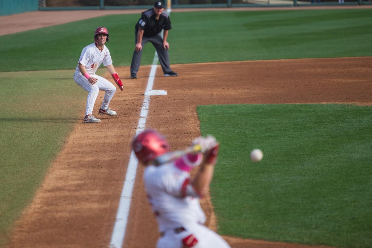 Alabama baseball infielder Brennan Holt (#4) watches his teammate bat against Rhode Island on Fed. 21, 2026. 