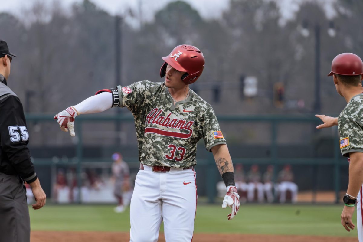 Alabama catcher John Lemm (#33) celebrates during the game versus Washington State on Feb. 14, 2026, at Sewell-Thomas Stadium. 