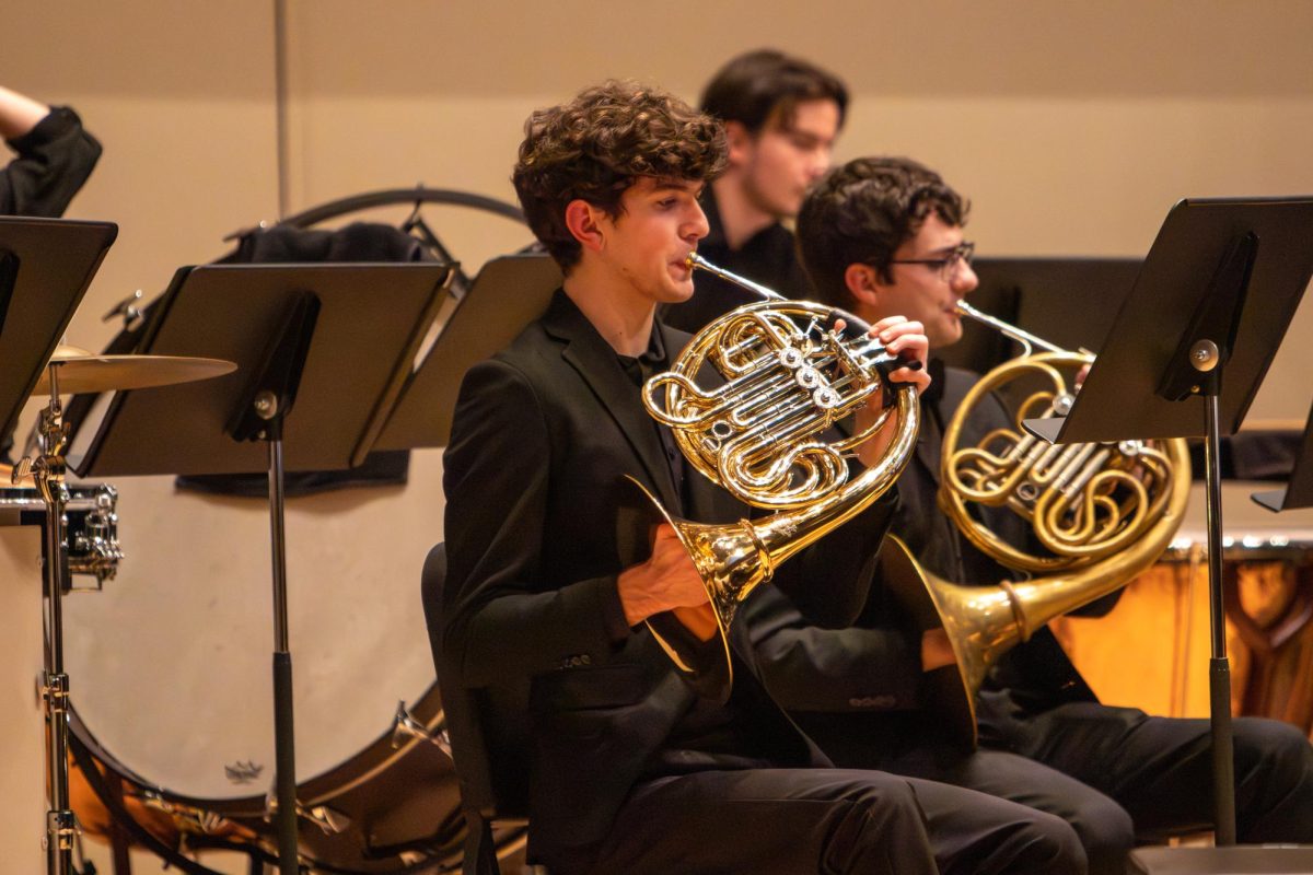 A student plays the French Horn at the Huxford Symphony Orchestra performance in Moody Music Hall on Feb. 12, 2026.