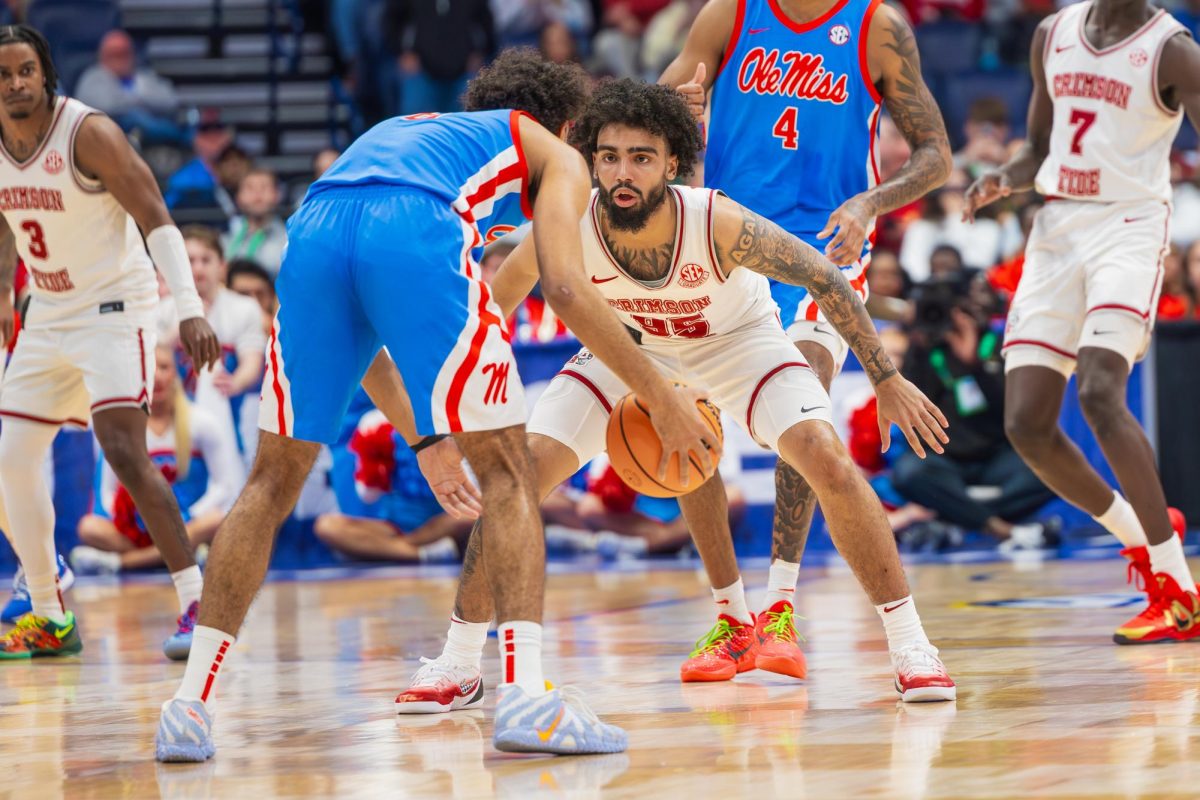 Alabama guard Houston Mallette (#95) guards against Ole Miss during the third round of the SEC Tournament on March 13, 2026, in Nashville, TN. 